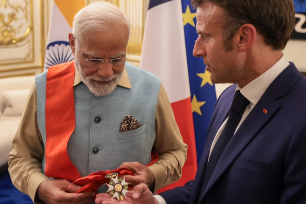 Emmanuel Macron Presents PM Narendra Modi with Highest Civilian Award during PM Modi’s Visit to France