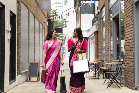 London’s streets exhibit saree-wearing women highlighting India’s heritage weaves.